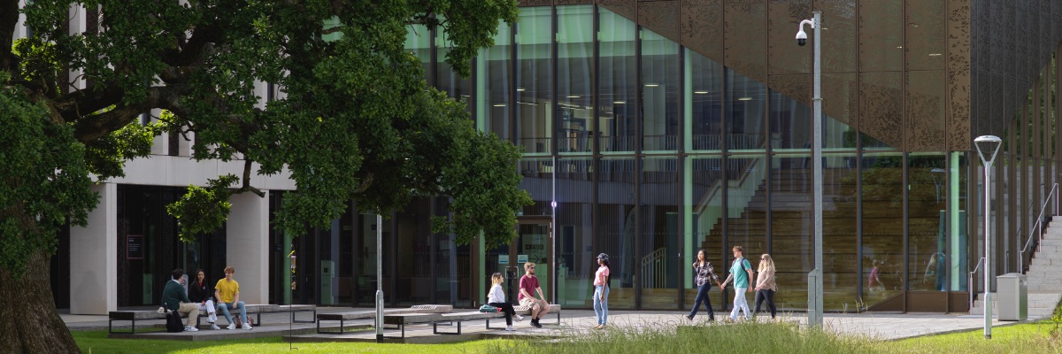 Green areas and a large oak tree surround the Health Innovation Centre.