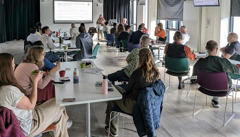 Participants on tables having a discussion 