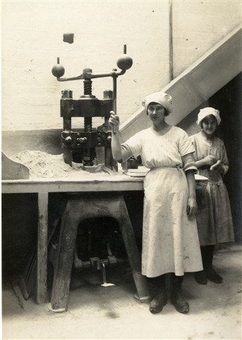 Two women in a factory