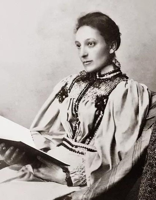 Black and white photo of a woman holding a book