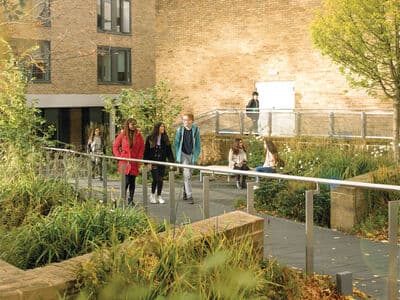 Group of students walking past the great hall