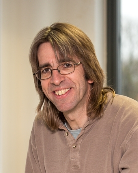 Portrait of Chris Grover smiling.