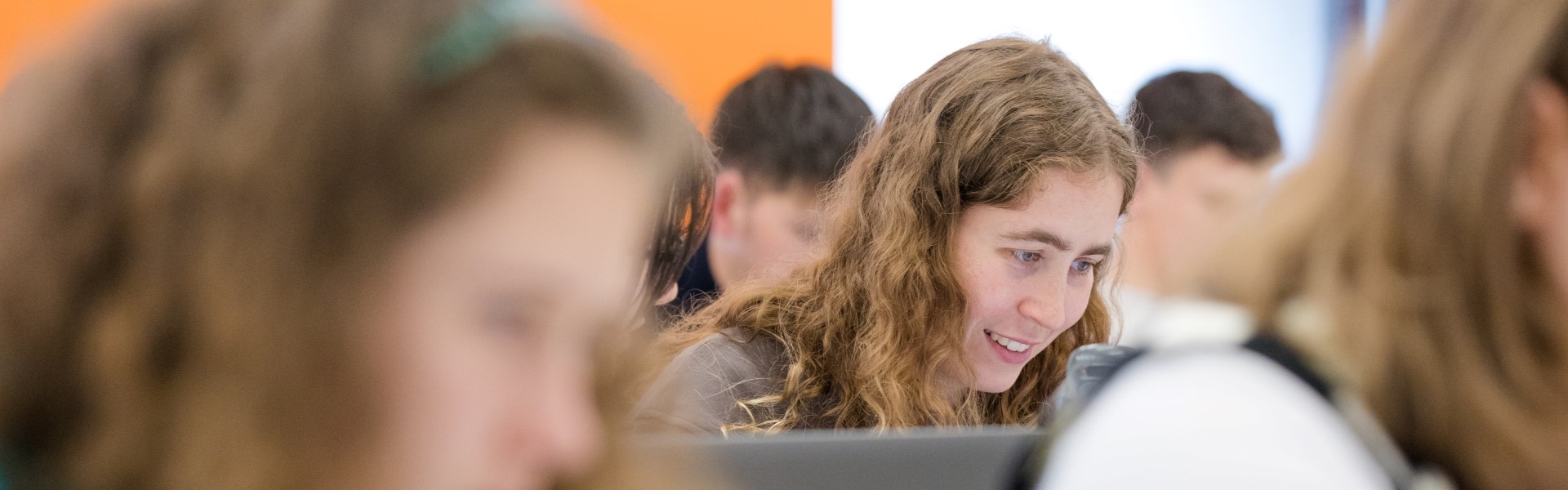 Image of a student working within an MRes lecture