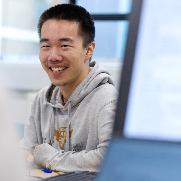 A student smiling at the camera