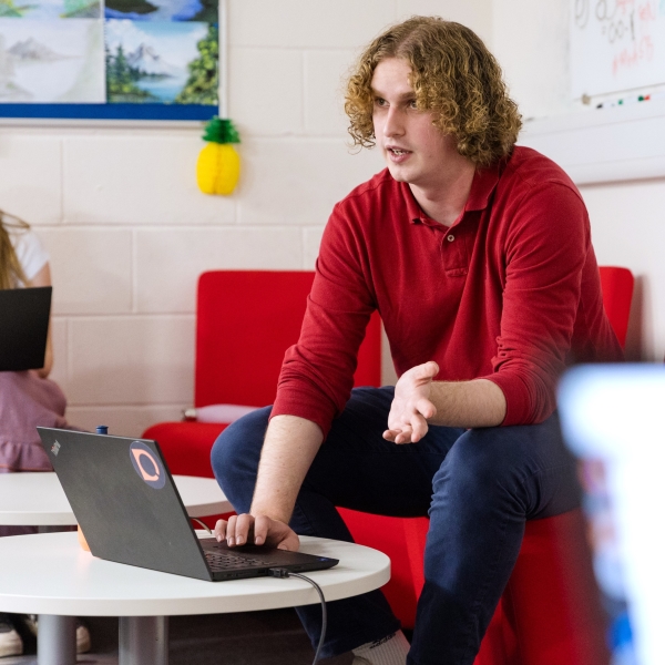 Image of a STOR-i student sat at a laptop