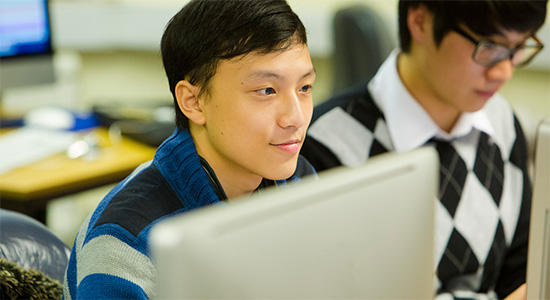 A young male law student reading a textbook.