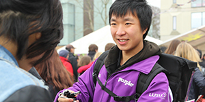 Student helping at outdoor event