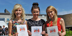 Students holding their Lancaster Award certificates