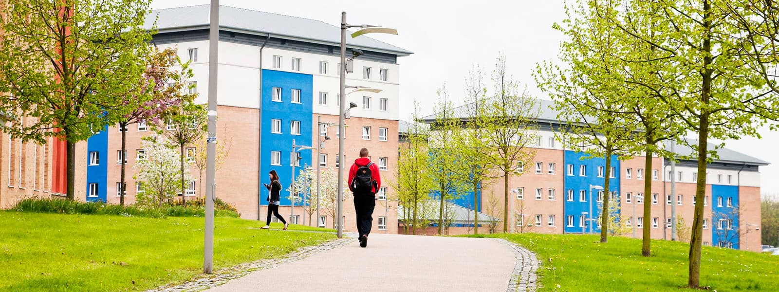 Student walking across campus