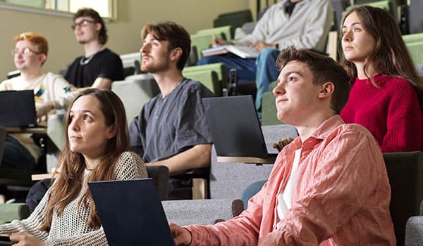 A group of students seated in a lecture theatre