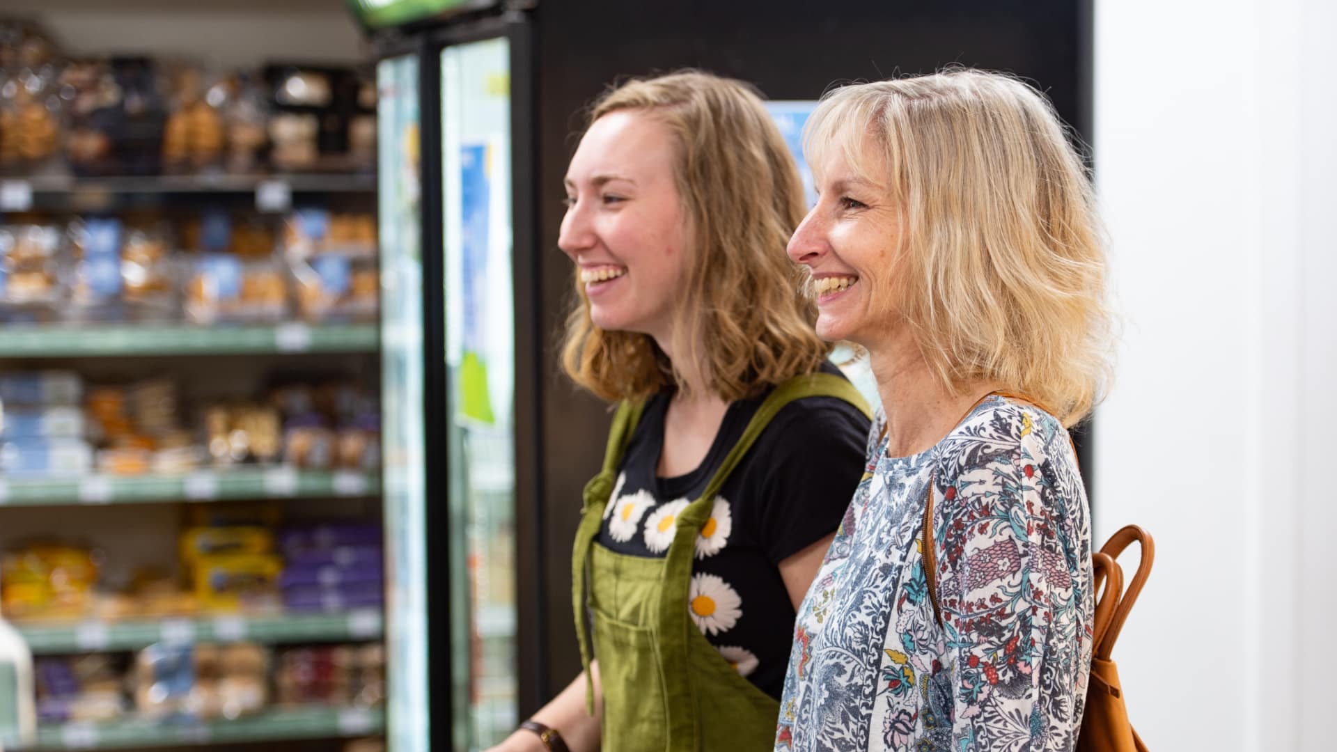A parent and new student shopping for supplies in a supermarket