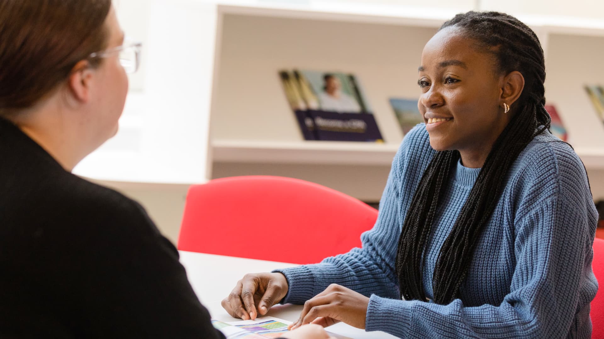 A student in a discussion with an advisor.