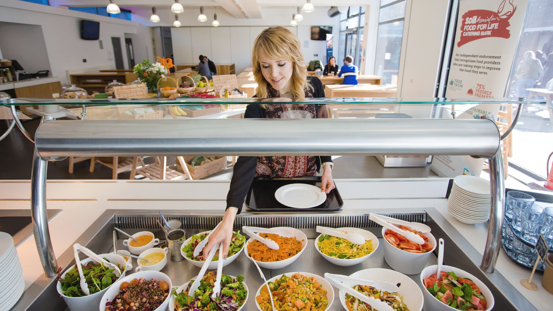 A student chooses from a buffet