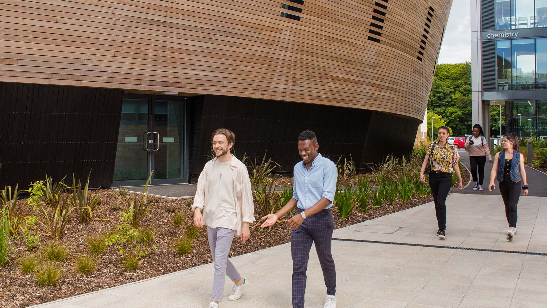 Students by the Margaret Fell lecture theatre