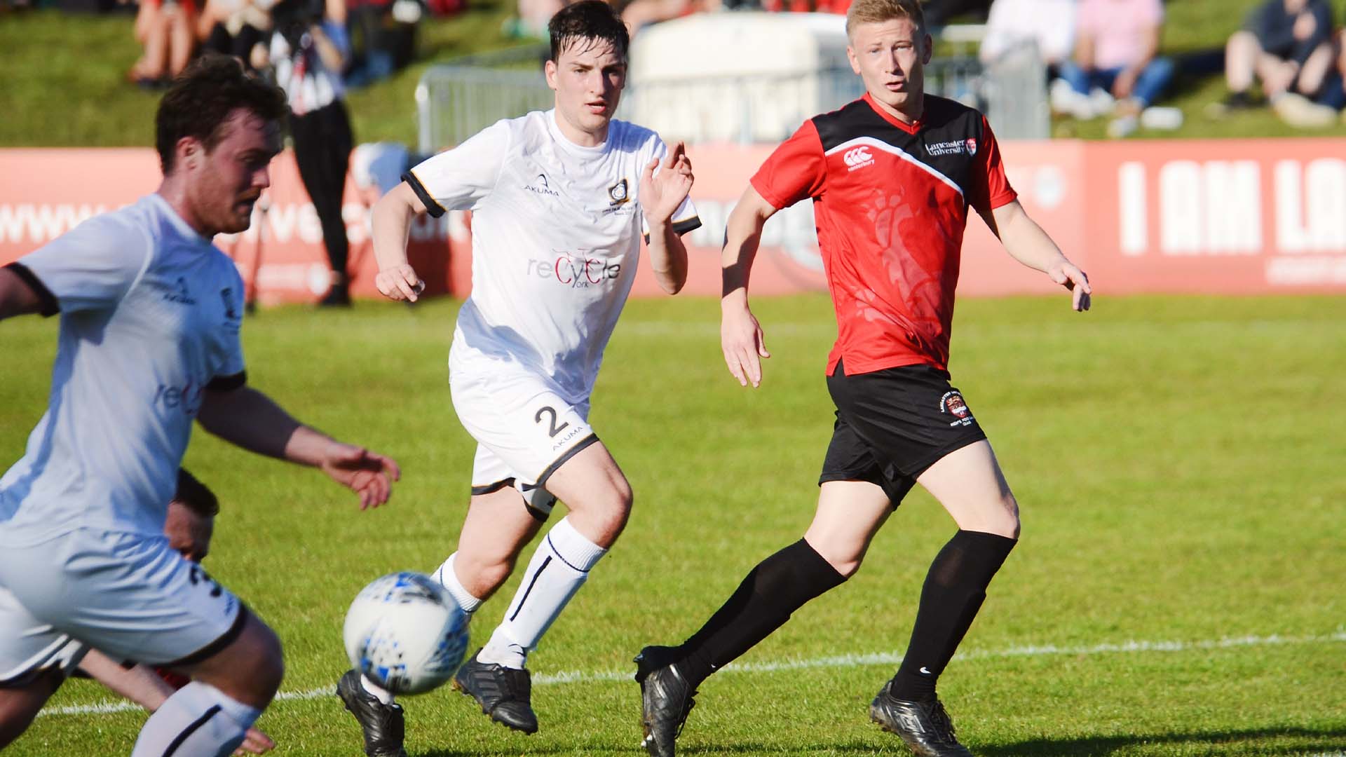 A football match at Roses. Lancaster plays in red, York in white.