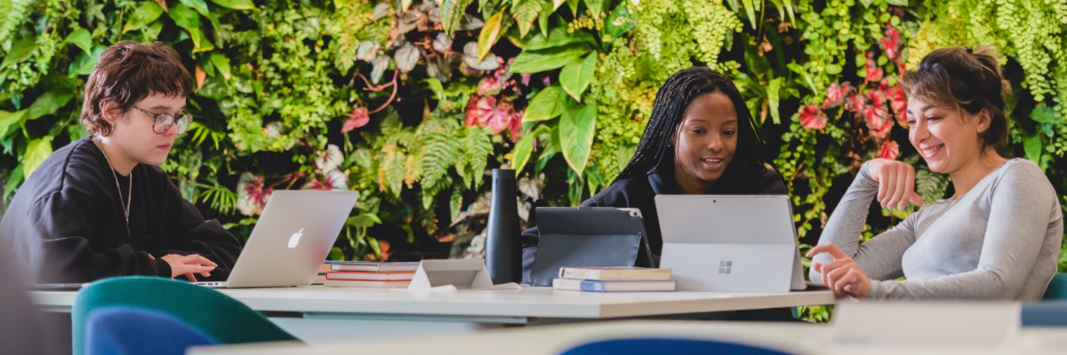 Students in the Library in front of the Green Wall