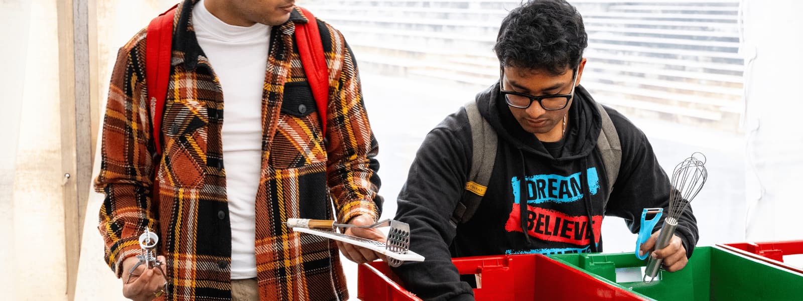 Two students buying items at the ECOMarket
