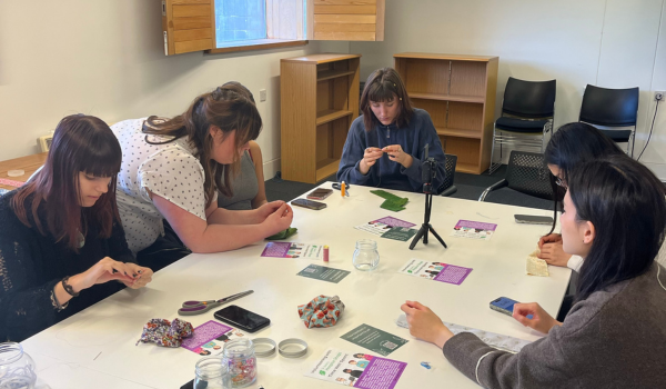 Students sat at a scrunchie making workshop