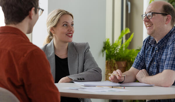 Staff sitting at a table