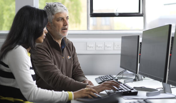 Man and woman sat at a computer