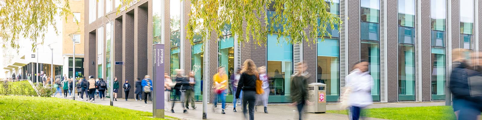 Students walking past the Charles Carter Building.