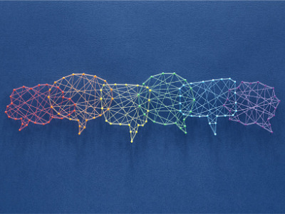 Social media concept. Network of pins and threads in the shape of many interconecting speech bubbles