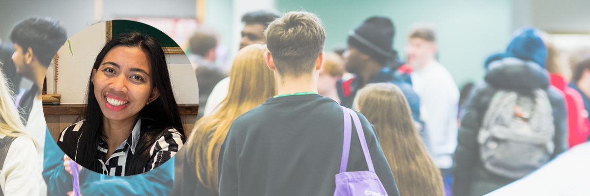 Student profile over an image taken during Freshers Fair on campus.