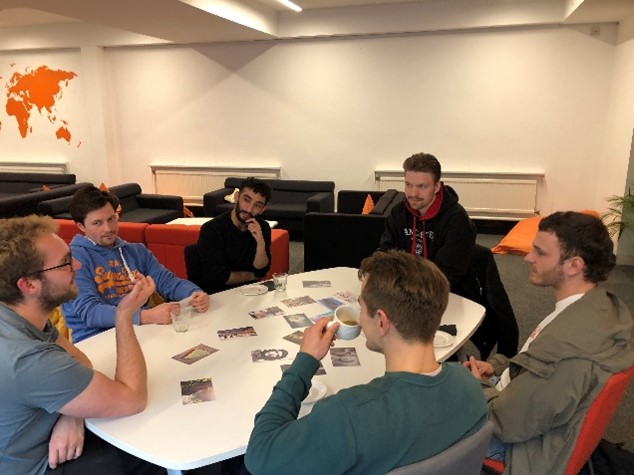 LSP students and staff having a discussion round a table during a peer support session